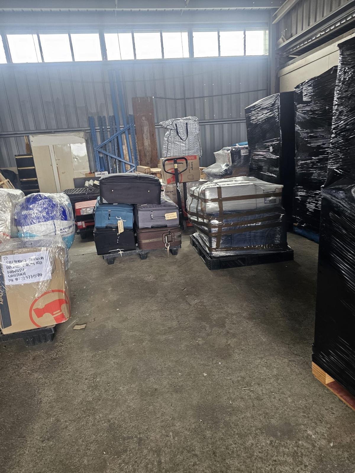 Luggage and personal effects staged in the warehouse